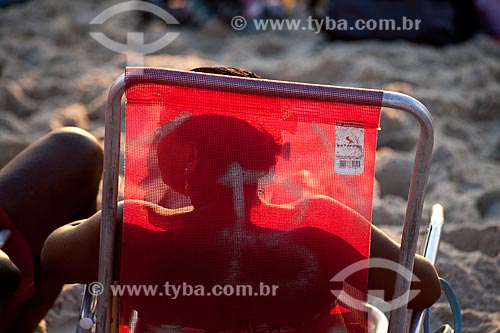  Subject: Woman on beach chair at Arpoador beach  / Place:  Ipanema neighborhood - Rio de Janeiro city - Brazil  / Date: 02/2011 