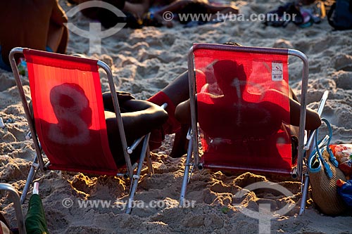  Subject: Couple of bathers on beach chairs at Arpoador beach  / Place:  Ipanema neighborhood - Rio de Janeiro city - Brazil  / Date: 01/2011 