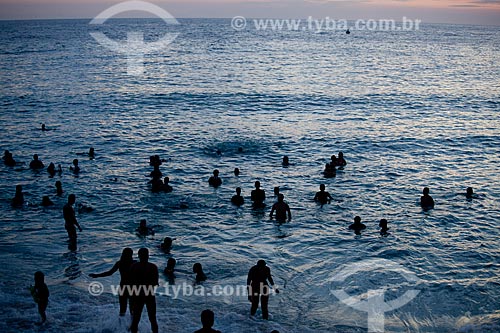  Bathers in the water of the Arpoador beach during the nightfall  - Rio de Janeiro city - Brazil