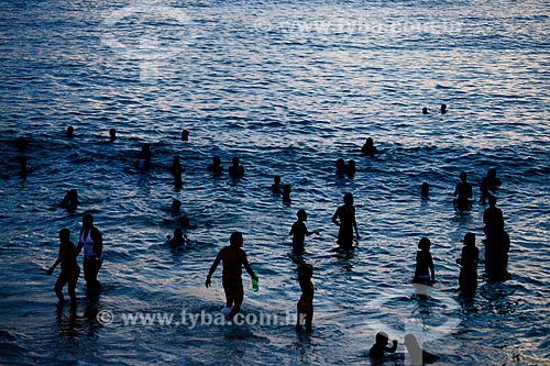  Bathers in the water of the Arpoador beach during the nightfall  - Rio de Janeiro city - Brazil