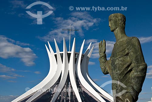  Subject: Sculpture of the Evangelist and in the background the Metropolitan Cathedral Nossa Senhora da Aparecida (The Cathedral of Brasilia) / Place: Brasilia city - Distrito Federal (Federal District) - Brazil / Date: 04/2010 