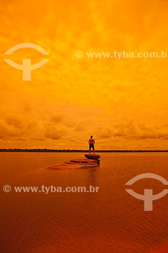  Subject: Man on top of rock in the Negro River / Place: Amazonas state (AM) - Brazil / Date: 10/2011 