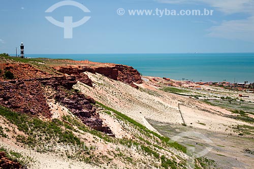  Subject: Cliffs in Ponta do Mel with Lighthouse in the background - The lighthouse was built in 1898 and is intended to signal the approach of the salineiro terminal of Areia Branca / Place: Areia Branca city - Rio Grande do Norte state (RN) - Brazi 