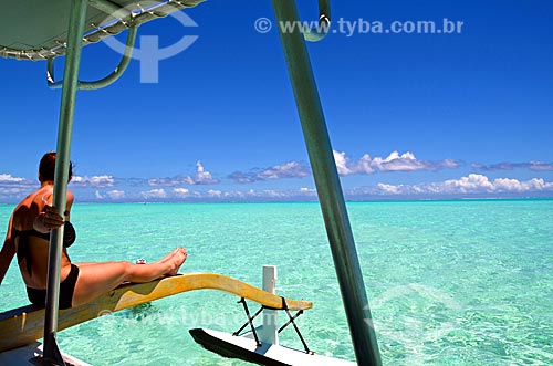  Subject: Woman sunbathing in a boat / Place: Bora Bora Island - French Polynesia - Oceania / Date: 10/2012 