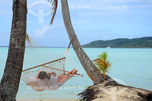  Subject: Couple resting in a hammock / Place: Tahaa Island - French Polynesia - Oceania / Date: 10/2012 