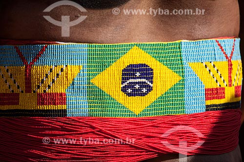  Indigenous belt with Brazilian flag made of beads during the Kuarup - this years ceremony in honor of the anthropologist Darcy Ribeiro - Photo Licensed (Released 94) - INCREASE OF 100% OF THE VALUE OF TABLE  - Gaucha do Norte city - Mato Grosso state (MT) - Brazil