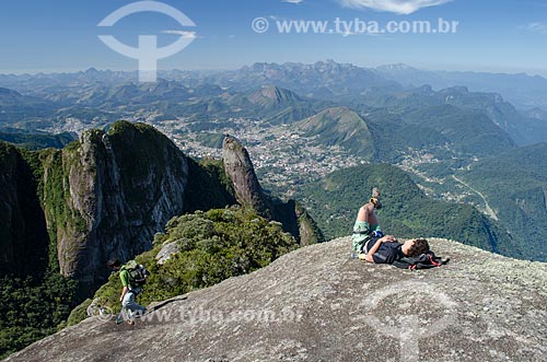  Subject: Man lying on top of Sao Joao Hill with Nose of Friar with wart and the Teresopolis city in the background / Place: Teresopolis city - Rio de Janeiro state (RJ) - Brazil / Date: 09/2012 