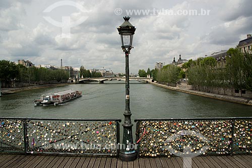  Locks with declaration of love in Pont des Arts (Arts Bridge) - the padlocks are placed by tourist couples that swearing eternal love play the key into the river and the padlock is closed forever   - Paris - Paris department - France