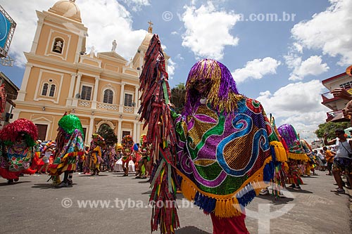  Spear caboclos in presentation of Maracatu Rural - also known as Baque Solto Maracatu - (New Cambinda Maracatu) with the Nossa Senhora da Conceicao Cathedral in the background   - Nazare da Mata city - Pernambuco state (PE) - Brazil