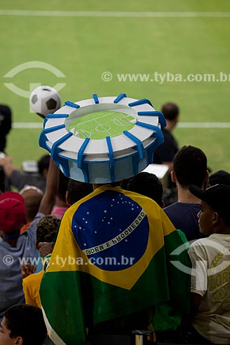  Fan with a mockup of the stadium in the head in test event at Journalist Mario Filho Stadium - also known as Maracana - match between Ronaldo friends x Bebeto friends marks the reopening of the stadium   - Rio de Janeiro city - Rio de Janeiro state (RJ) - Brazil