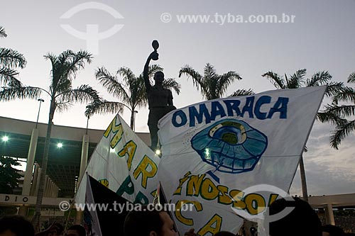  Protesters with banners protesting against the privatization of Journalist Mario Filho Stadium also known as Maracana and buildings to your surroundings - in the reinauguration of the stadium  - Rio de Janeiro city - Rio de Janeiro state (RJ) - Brazil