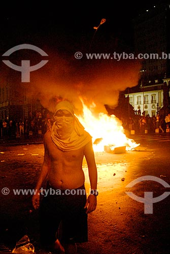  Protester with barricade with garbage burned in the background during the manifestation known as Free Pass Movement  - Rio de Janeiro city - Rio de Janeiro state (RJ) - Brazil