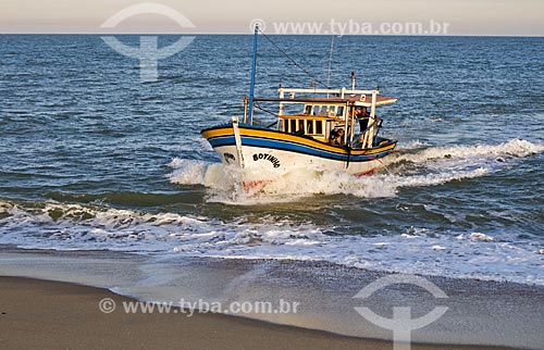  Subject: Fishing boat on the beach coming from Farol de Sao Thome,by not having a port for docking fishermen need to use tractors to take the boats to the sea / Place: Farol de Sao Thome neighborhood -  Campos dos Goytacazes city - Rio de Janeiro st 