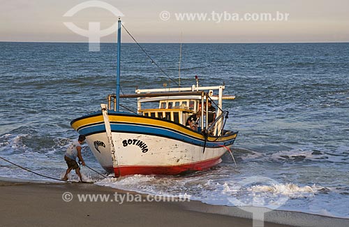  Subject: Fishing boat on the beach coming from Farol de Sao Thome,by not having a port for docking fishermen need to use tractors to take the boats to the sea / Place: Farol de Sao Thome neighborhood -  Campos dos Goytacazes city - Rio de Janeiro st 