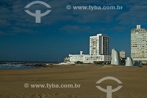  Subject: Monumento al Ahogado (Monument to the Drowned) - also known as La mano (The hand) - 1982 - with buildings in the background / Place: Punta Del Este city - Maldonado Department - Uruguay - South America / Date: 09/2013 