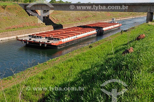  Chata (kind of ferry) transporting grains - Deoclecio Bispo dos Santos Channel - Channel that connects Tiete River and Parana River and is used by vessels - Waterway transport  - Pereira Barreto city - Sao Paulo state (SP) - Brazil