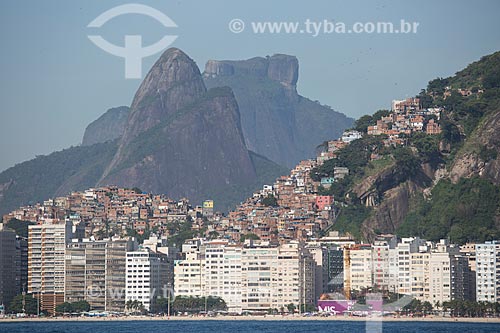  Subject: Copacabana Beach buildings with the Cantagalo slum - to the lefth - and Pavao Pavaozinho slum - to the right - with the Morro Dois Irmaos (Two Brothers Mountain) and Rock of Gavea in the background / Place: Copacabana neighborhood - Rio de  