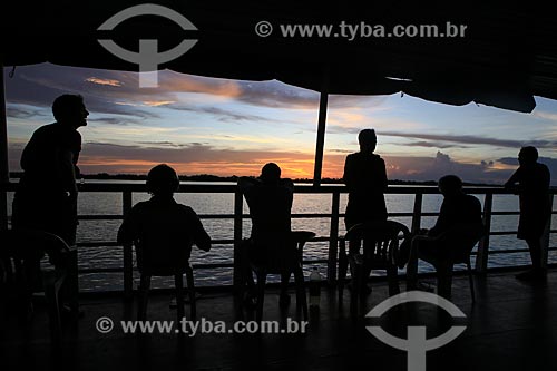  Subject: Passengers observing the sunset - Amazonas River / Place: Santarem city - Para state (PA) - Brazil / Date: 03/2014 