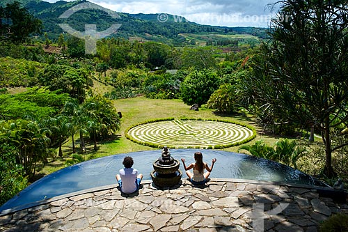  Subject: Couple meditating in garden of Lakaz Chamarel Exclusive Lodge hotel - Chamarel village / Place: Riviere Noire District - Mauritius - Africa / Date: 11/2012 