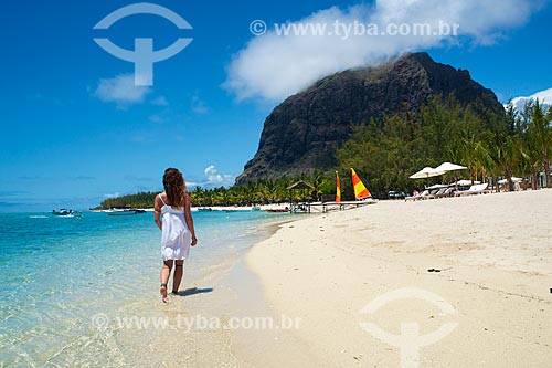  Subject: Woman walking in beach with the mountain - Le Morne Brabant Peninsula - in the background / Place: Riviere Noire District - Mauritius - Africa / Date: 11/2012 