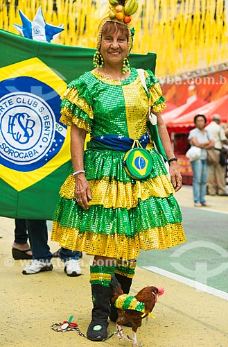  Mrs Maria de Lourdes and Fred rooster - Alzirao (Alzira Brandao Street) during the match between Cameroon x Brazil by World Cup of Brazil  - Rio de Janeiro city - Brazil