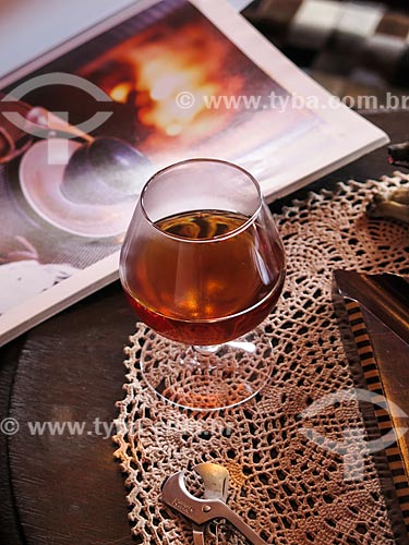  Subject: Goblet of brandy and cigar cutter on the table during the winter / Place: Canela city - Rio Grande do Sul state (RS) - Brazil / Date: 05/2014 