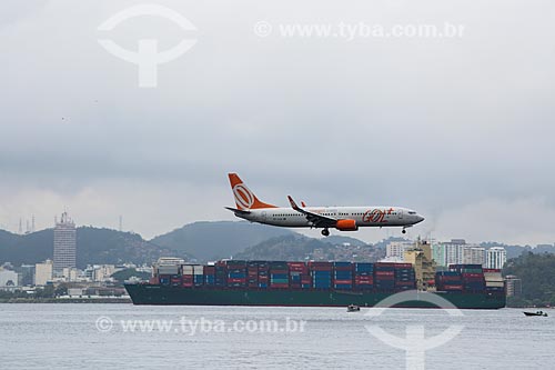  Airplane of GOL - Intelligent Airlines - preparing to land - Santos Dumont Airport with cargo ship in the background  - Rio de Janeiro city - Rio de Janeiro state (RJ) - Brazil