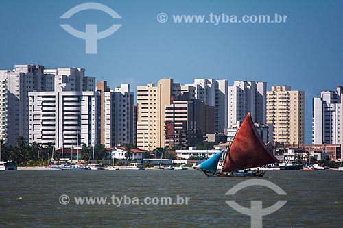  Boat - river mouth of Bacanga River with buildings in the background  - Sao Luis city - Maranhao state (MA) - Brazil