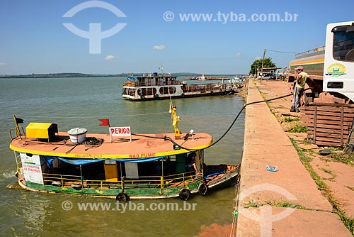  Floating gas station being fueling for tanker truck on the banks of the Tapajos River  - Itaituba city - Para state (PA) - Brazil