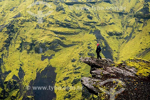  Woman watching the landscape during trekking in the Vik í Mýrdal village region  - Southern Region - Iceland