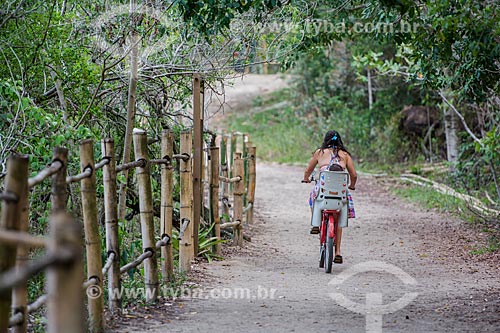  Woman and child - bicycle near to Vila do Abraao (Abraao Village)  - Angra dos Reis city - Rio de Janeiro state (RJ) - Brazil