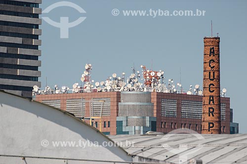  Detail of antennas - Teleporto of Rio de Janeiro city with chimney of Perola Sugar old factory to the right  - Rio de Janeiro city - Rio de Janeiro state (RJ) - Brazil