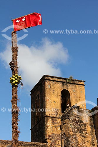  Flag of Divino - Matriz Square - with ruins of the Sao Matias Church in the background  - Alcantara city - Maranhao state (MA) - Brazil
