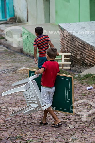  Boy carrying a button football table in the Horto Hill  - Juazeiro do Norte city - Ceara state (CE) - Brazil