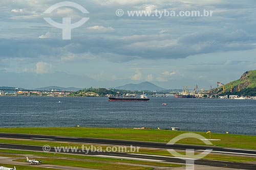  Track of Santos Dumont airport with cargo ship and Rio-Niteroi bridge in the background  - Rio de Janeiro city - Rio de Janeiro state (RJ) - Brazil