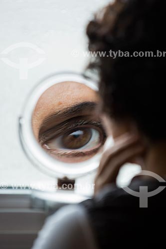  Reflection in makeup mirror of woman eye  - Anapolis city - Goias state (GO) - Brazil