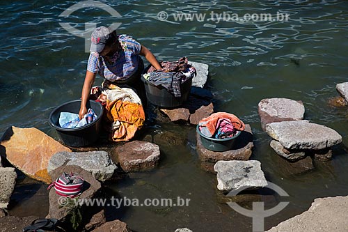  Washerwoman on the banks of Lake Atitlan  - Solola department - Republic of Guatemala