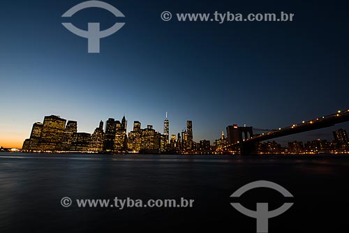 View of Brooklyn Bridge (1883) over of East River at evening  - New York city - New York - United States of America