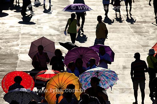  People protecting yourself from the sun with umbrella
  - Manaus city - Amazonas state (AM) - Brazil
