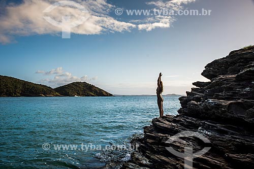  Woman practicing Yoga - Joao Fernandinho Beach - ekam movement (sun salutation)  - Armacao dos Buzios city - Rio de Janeiro state (RJ) - Brazil