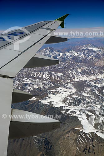  View of airplane wing during flight over of the Andes Mountain  - Chile