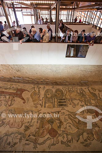  Tourists observing the mosaic known as Great Hunt - Villa Romana del Casale - old palace building IV century  - Piazza Armerina city - Enna province - Italy