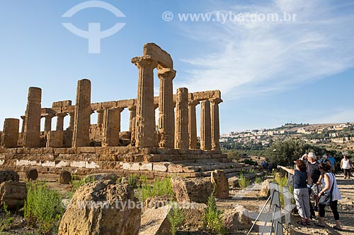  Tourists observing - Temple of Juno - Valle dei Templi (Valley of the Temples) - ancient greek city Akragas  - Agrigento city - Agrigento province - Italy
