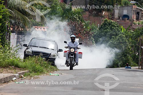  Motorcycle with Ultra-Low Volume (ULV) equipment - also known as cold fogging machine - combat to yellow fever mosquito (Aedes aegypti)  - Manaus city - Amazonas state (AM) - Brazil