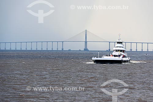  Ferry - Negro River during rain with the Negro River Bridge (2011) in the background  - Manaus city - Amazonas state (AM) - Brazil