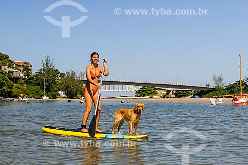  Practitioner of stand up paddle and dog - Restinga Marambaia - the area protected by the Navy of Brazil  - Rio de Janeiro city - Rio de Janeiro state (RJ) - Brazil