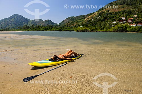  Practitioner of stand up paddle sunbathing - Restinga Marambaia - the area protected by the Navy of Brazil  - Rio de Janeiro city - Rio de Janeiro state (RJ) - Brazil