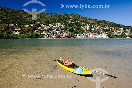  Practitioner of stand up paddle sunbathing - Restinga Marambaia - the area protected by the Navy of Brazil  - Rio de Janeiro city - Rio de Janeiro state (RJ) - Brazil