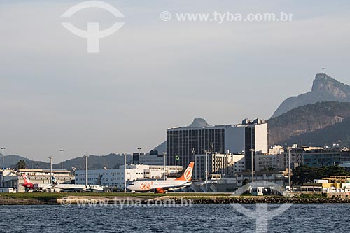  Airplane of TAM Airlines and GOL - Intelligent Airlines - Santos Dumont Airport (1936) with the Christ the Redeemer in the background  - Rio de Janeiro city - Rio de Janeiro state (RJ) - Brazil