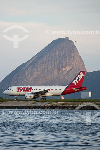  Airplane of TAM Airlines - runway of the Santos Dumont Airport with the Sugar Loaf in the background  - Rio de Janeiro city - Rio de Janeiro state (RJ) - Brazil
